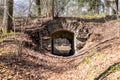 old stone gate with arched vault in the woods Royalty Free Stock Photo