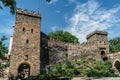 Old stone gate to Bitov Castle on steep promontory towering above meandering River Zeletavka,Czech Republic.Popular Gothic chateau