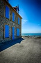 Old stone house with blue shutters Royalty Free Stock Photo