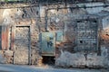 An old stone house with boarded up doors and windows brick Royalty Free Stock Photo