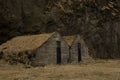 Old stone house destroyed ancient Viking overgrown with yellow dry grass Royalty Free Stock Photo