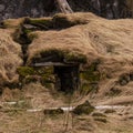 Old stone house destroyed ancient Viking overgrown with yellow dry grass Royalty Free Stock Photo