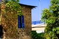 old stone house beside a highway bridge Royalty Free Stock Photo