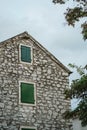 Old stone house and windows with closed shutters in Biograd na Moru of Croatia Royalty Free Stock Photo