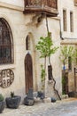 Old stone house with wooden door and balcony Royalty Free Stock Photo