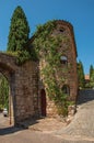 Old stone houses in alley under blue sky at Les Arcs-sur-Argens.