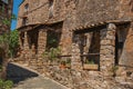 Old stone houses in alley under blue sky at Les Arcs-sur-Argens.