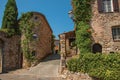 Old stone houses in alley under blue sky at Les Arcs-sur-Argens.