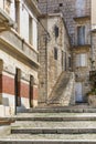 Old stone houses in a charming alley, typical Mediterranean architecture, island Vis, Komiza, Croatia Royalty Free Stock Photo