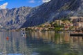 Old stone houses in Kotor Bay with mountains and crystal clear water in the Balkans, Montenegro on the Adriatic Sea Royalty Free Stock Photo