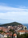Old stone houses with red roofs on the seashore overlooking the mountains. Dubrovnik, Croatia Royalty Free Stock Photo
