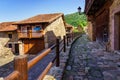 Old stone houses with wooden fencing in the streets. Barcena Mayor Santander