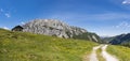 Old stone hut with mountain Gartnerkofel in Carnic Alps Royalty Free Stock Photo
