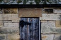 Old Stone Ice House with Wooden doors. Royalty Free Stock Photo