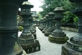 Old stone lanterns of shintoism shrine in Tokyo Japan