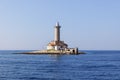 Old stone lighthouse on small island