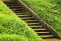 Old stone mossy staircase in lush green grass Royalty Free Stock Photo