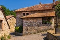 Old stone mountain mansions with red roofs. Carmona, Cantabria, Spain