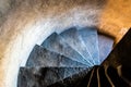 Old stone narrow spiral staircase inside the medieval tower Royalty Free Stock Photo