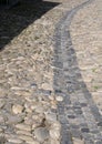 Old stone paved road water ditch