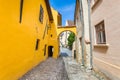 Old stone paved street with tourists from Sighisoara fortress Royalty Free Stock Photo