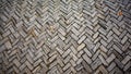 Old stone pavement with herringbone pattern. Weathered stone pavement arranged in a herringbone pattern, with moss in the gaps and Royalty Free Stock Photo