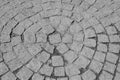 Old stone paver sidewalk texture in circular pattern