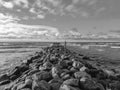 An old stone pier in to the sea on a sunny evening. Dramatic look Royalty Free Stock Photo
