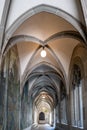 Old stone pillars and arcades inside the courtyard of Fraumunster church in Zurich city Switzerland. Wide angle view, no people