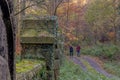 Old stone pillars in the forest overgrown with plants Royalty Free Stock Photo
