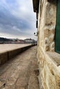 Old stone promenade and facade with views to the Douro river