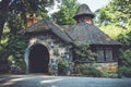 Old stone pumphouse in tudor revival architecture