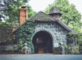 Old stone pumphouse in tudor revival architecture Royalty Free Stock Photo