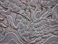 Old stone relief in buddhist temple in Vietnam, South-East Asia.