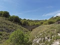 An old Stone Road Bridge straddling a small steep sided Valley in the Andalucian region of Spain.