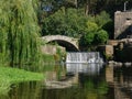 Old stone ruins and ancient Roman bridge on River Este in Touginho, Portugal. Royalty Free Stock Photo