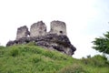 Old stone ruins on a background of green grass Royalty Free Stock Photo