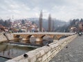 Old stone Seher Cehaja bridge over Miljacka river in Sarajevo Royalty Free Stock Photo