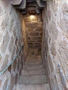 Old stone spiral staircase in banos de la encina castle Royalty Free Stock Photo