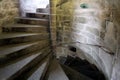 Old stone spiral staircase going up the inside of a castle tower Royalty Free Stock Photo