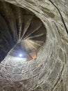 An old, stone spiral staircase in the Kolossi castle in Cyprus Royalty Free Stock Photo