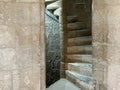 An old, stone spiral staircase in the Kolossi castle in Cyprus Royalty Free Stock Photo