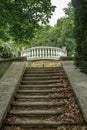 Old stone staircase in an abandoned park. Fallen leaves lie on old steps and railings of stairs. concept is abandoned architecture Royalty Free Stock Photo