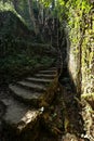 Old stone staircase in the ancient abandoned mines in the Calcaferro mining archaeological park in Mulina di Stazzema. Royalty Free Stock Photo