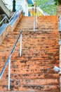 Old stone staircase with weathered shabby steps rises up, selective focus