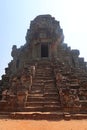 Stone stairs leading from red sand up to top of temple in angkor wat, cambodia, construction metal for saftey