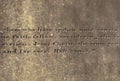 Old stone surface with the engraved words from Hebrews Royalty Free Stock Photo