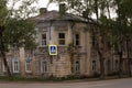 Old stone tumbledown house in russian provincial town at sunset