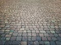 Old stone vintage pavement texture. Granite cobblestoned