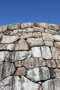 Old stone wall against blue sky Royalty Free Stock Photo